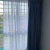 day curtain layered with dim-out night curtain